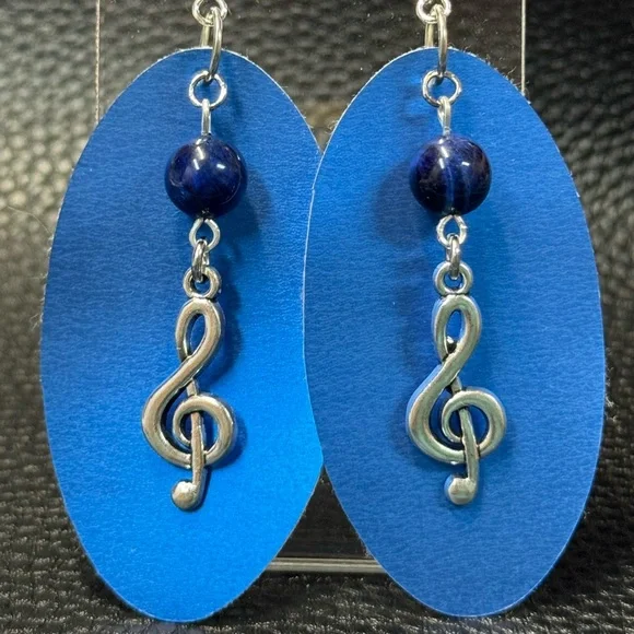 Handmade blue faux leather earrings with treble cleft charms - Picture 1 of 3